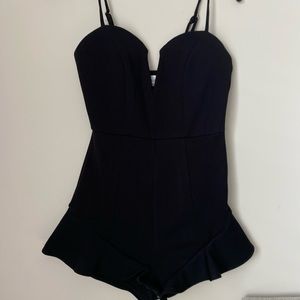 Black trendy romper ruffle bottom